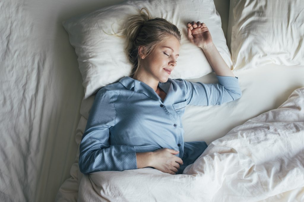 woman getting good sleep in recovery