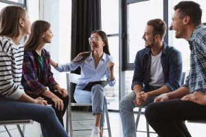 a group therapy session taking place in long-term rehab