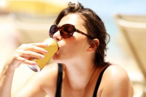 woman drinking an alcoholic beverage and wondering are white claws addictive