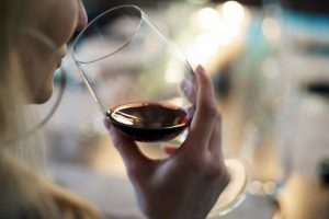 person drinking a glass of wine and wondering Can you get drunk on wine coolers