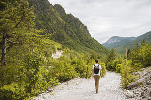 Hiker hiking in Accursed mountains Theth Shkoder Albania Europe
