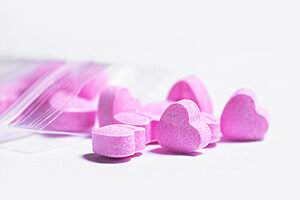 Ziplock bag and pink heart shaped pills