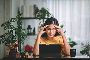 asian woman struggling with mental health