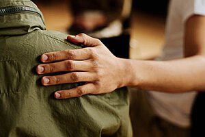 patient comforts peer in a trauma therapy program