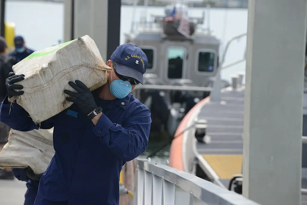 USCG unloading a cocaine shipment from a cocaine seizure